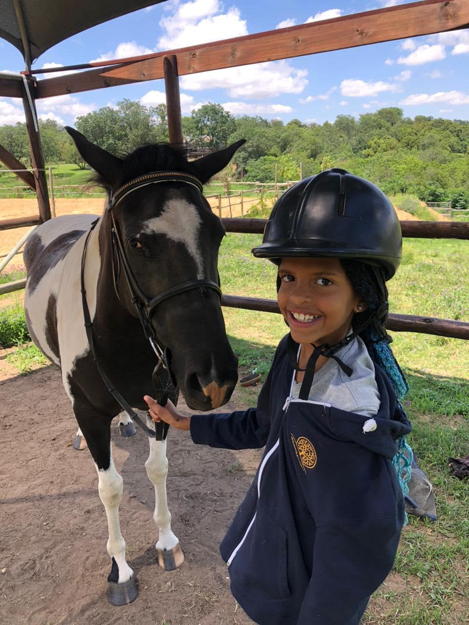 Child on a horse riding lesson